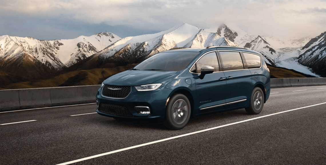 2022 Chrysler Pacifica driving down a road